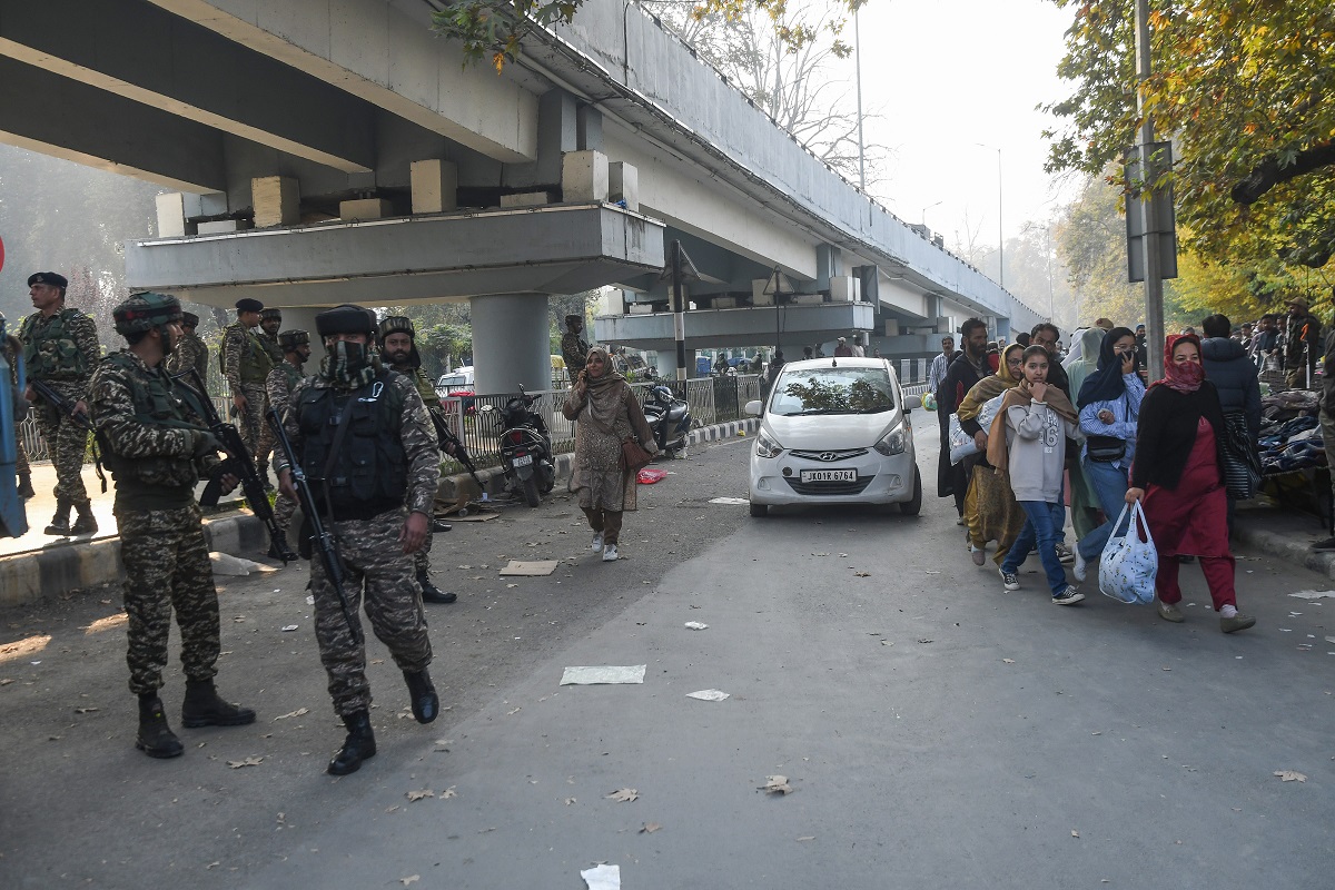 Security personnel cordon off the area after explosion at Sunday market in Srinagar. PTI photo