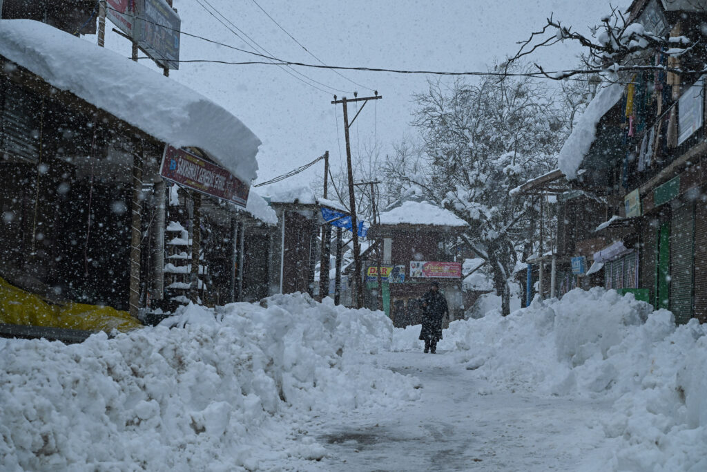 First Snow Brings Life To A Halt in Kashmir Valley